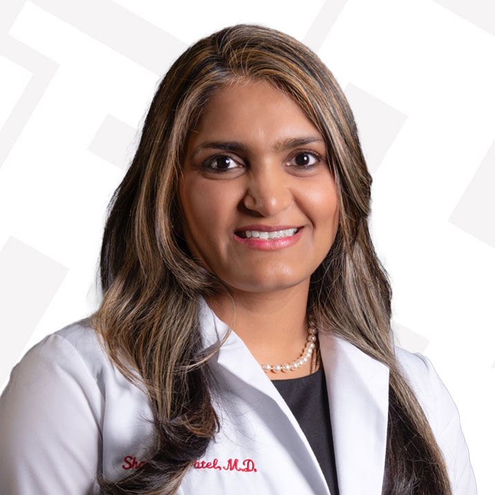 woman in white lab coat patel